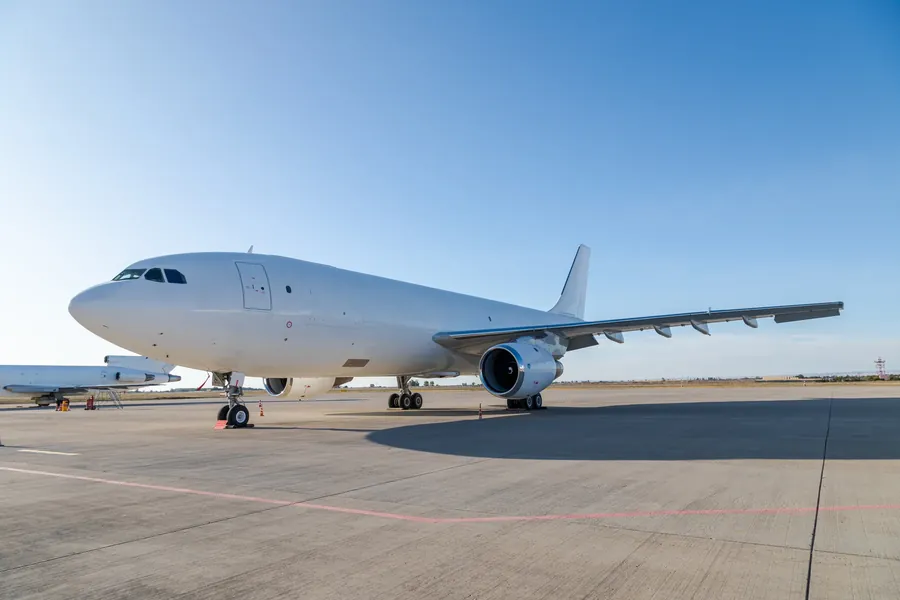 White airliner parked on apron