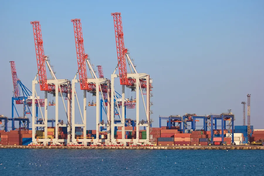 Quay cranes and containers across the water