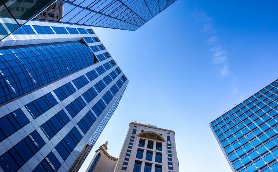 Blue glass towers under a clear sky