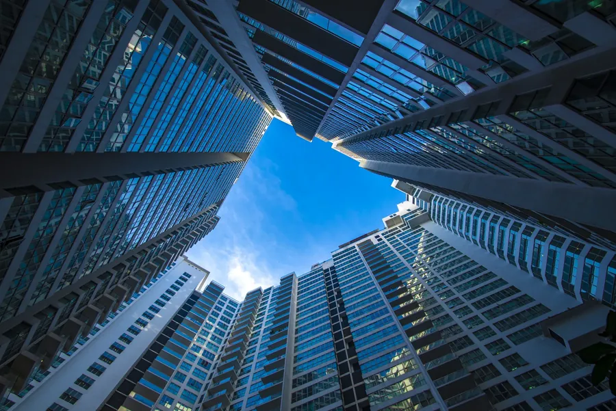 Blue towers closing round a patch of sky