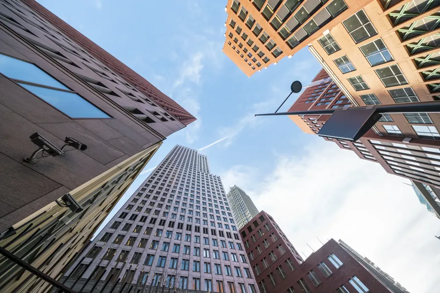 Mixed towers from the street, looking up