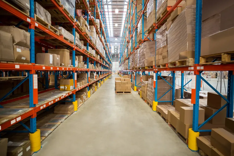 Warehouse aisle between tall racking