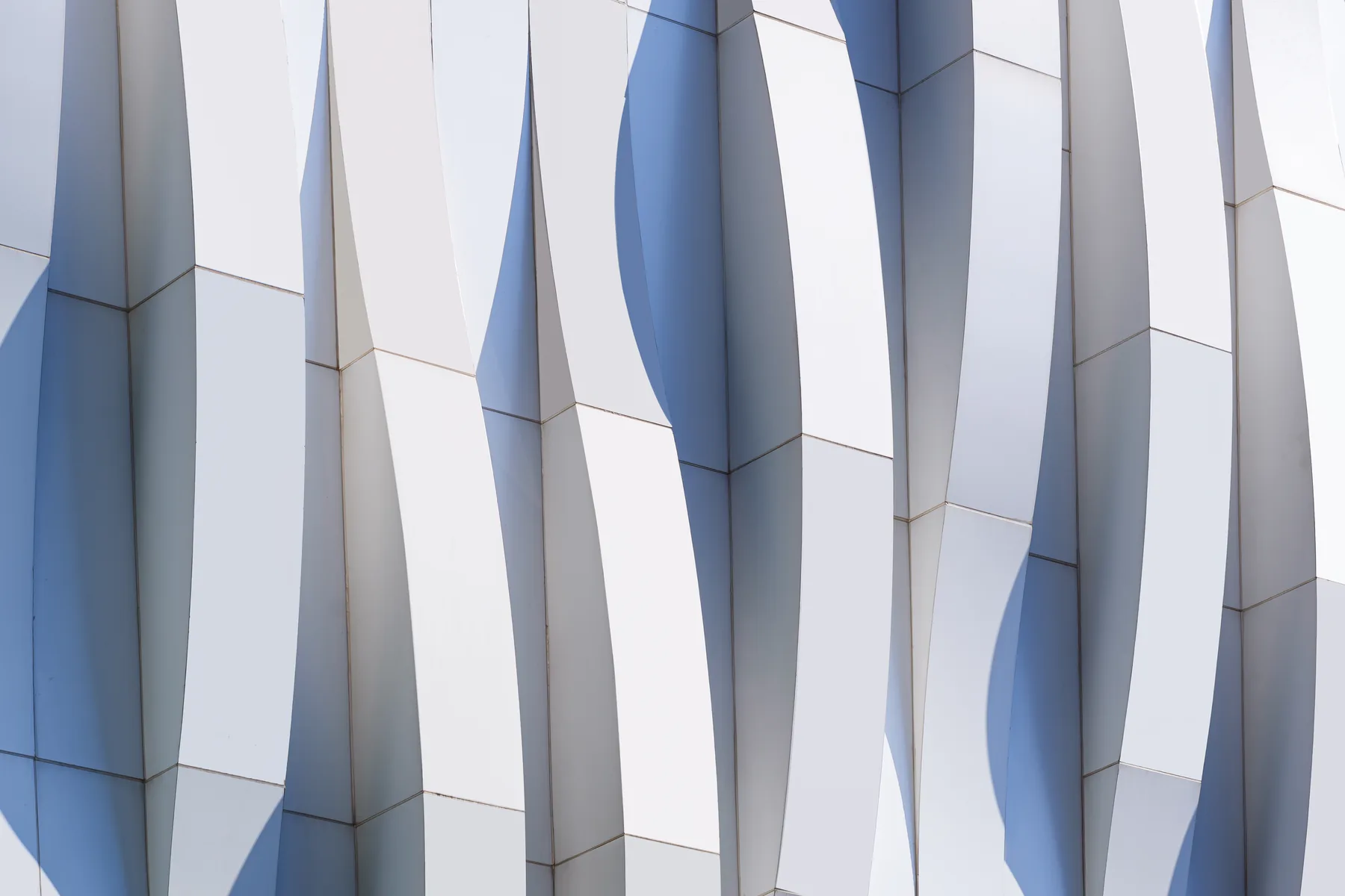 White vertical fins with a wave running through them