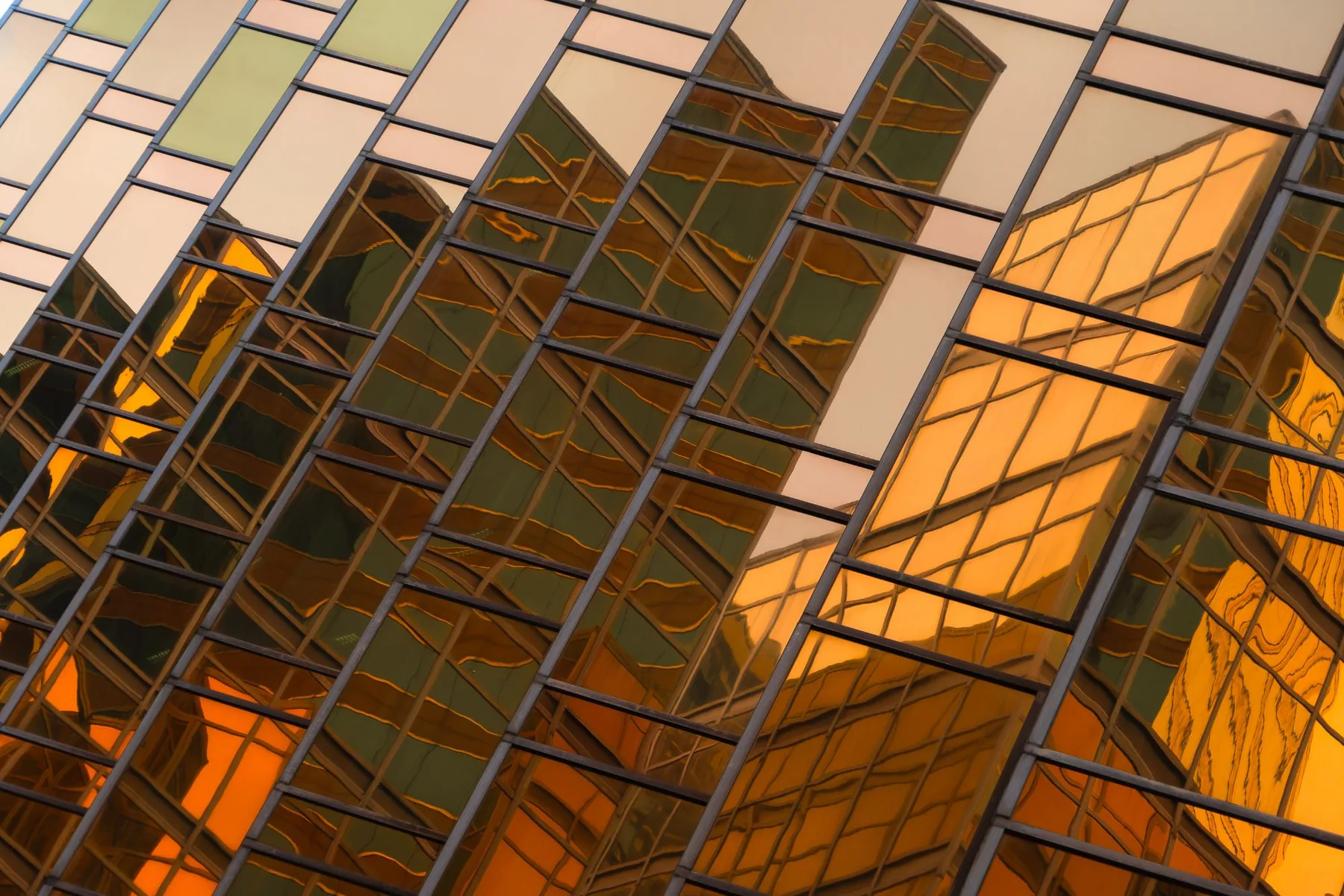 A gold glass facade rising on a diagonal