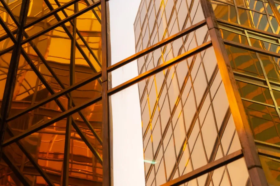 Two amber glass towers either side of a gap of white sky