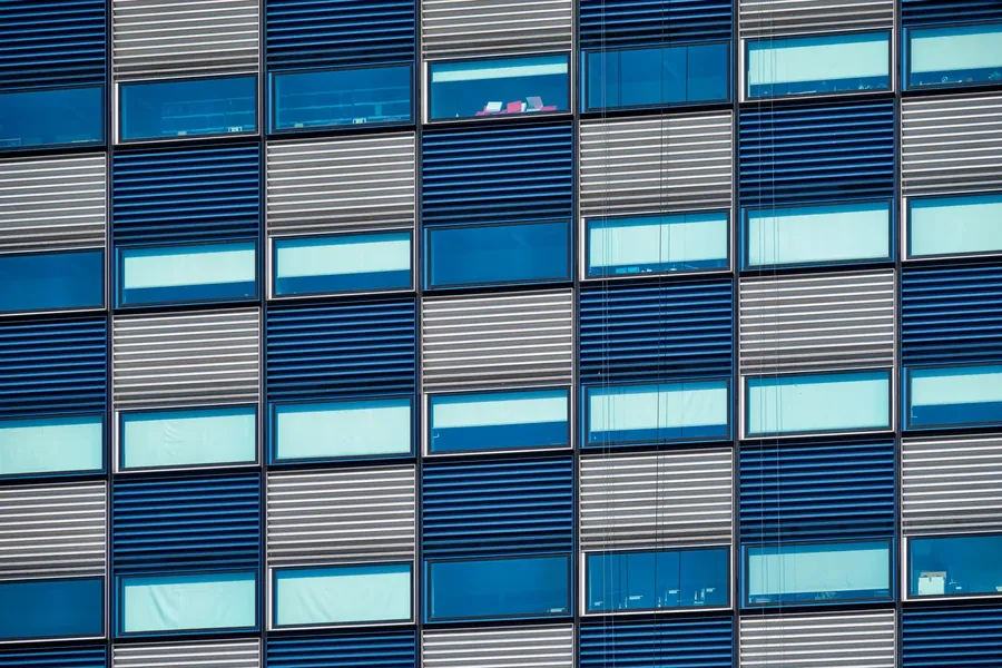 An office facade with blue louvres