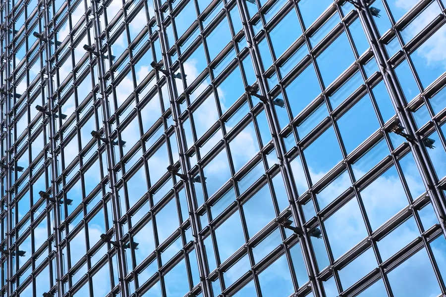 Glass curtain wall, sky reflected