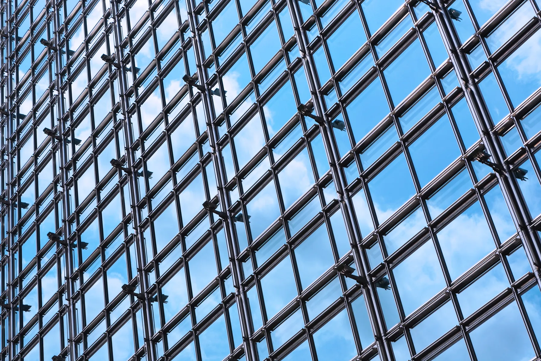 Glass curtain wall, sky reflected
